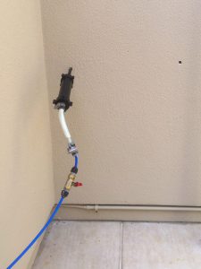 RotStop being injected into the wall of a house
